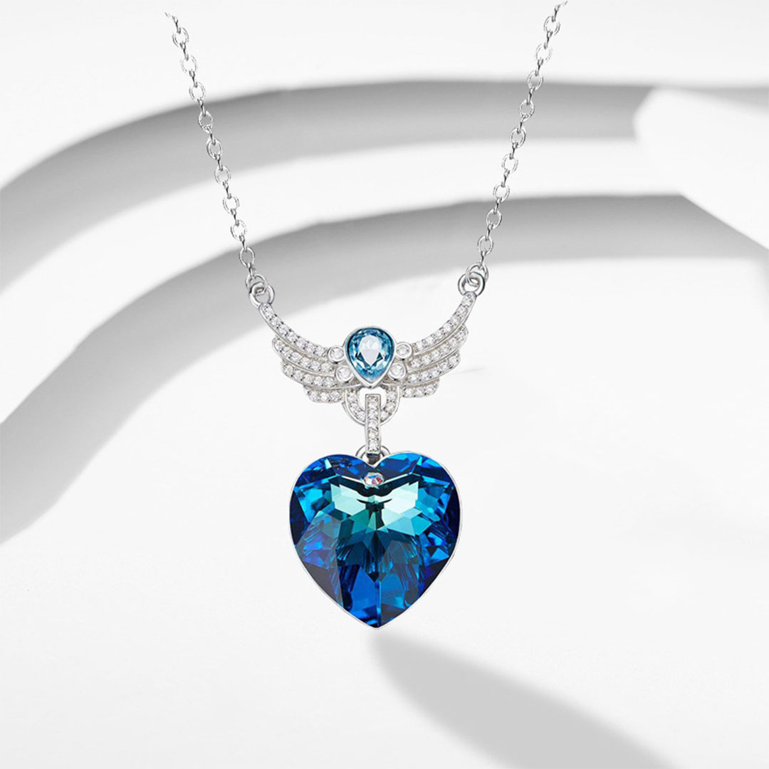 قلادة نسائية فاخرة بشكل طائر وقلب مرصعة بالكريستال الأزرق